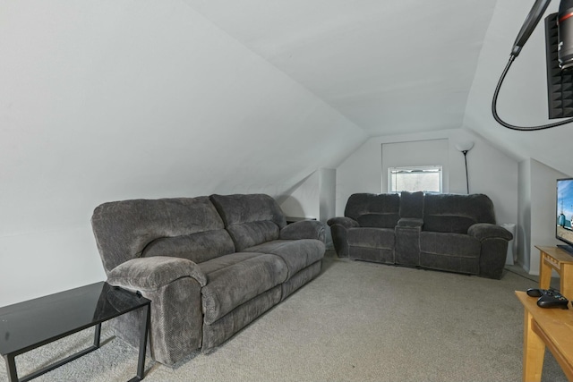 carpeted living room with lofted ceiling