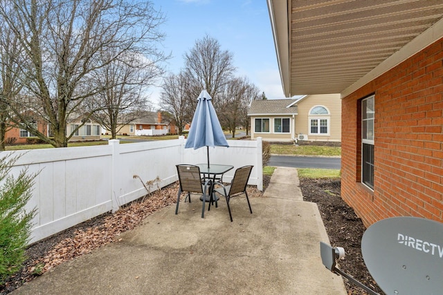 view of patio / terrace featuring fence and outdoor dining space