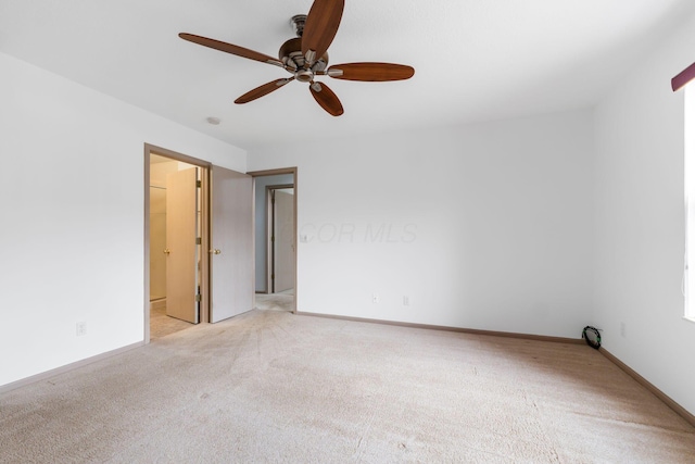 spare room with light colored carpet