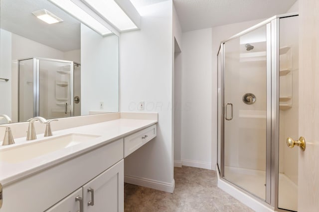 bathroom with vanity and walk in shower