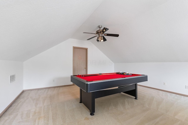 game room with baseboards, light colored carpet, visible vents, and a textured ceiling