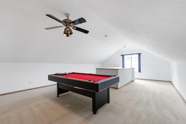 recreation room with light carpet, lofted ceiling, and baseboards