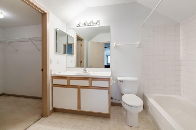 full bathroom with tiled shower / bath combo, vanity, vaulted ceiling, tile patterned floors, and toilet