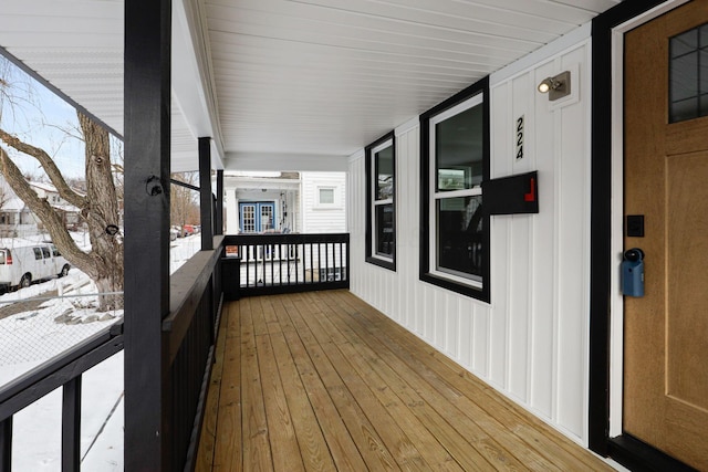 view of snow covered deck