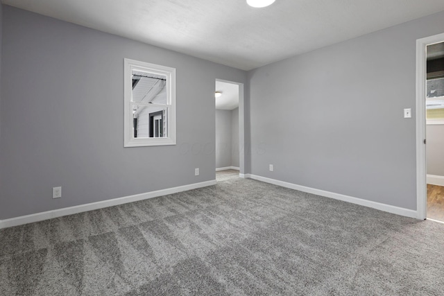 empty room featuring carpet flooring