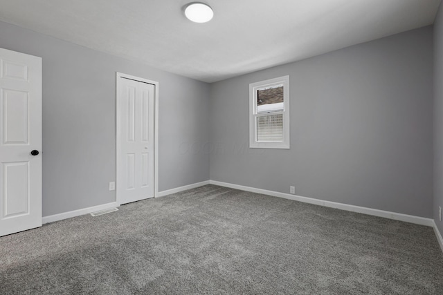 unfurnished room with carpet floors