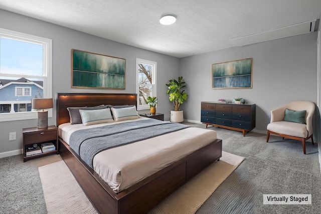 bedroom with light colored carpet and multiple windows