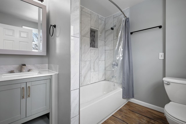 full bathroom featuring toilet, vanity, shower / bath combination with curtain, and hardwood / wood-style flooring