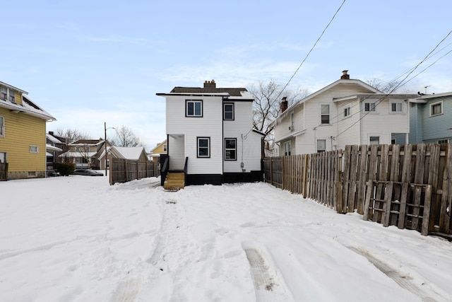 view of snow covered house