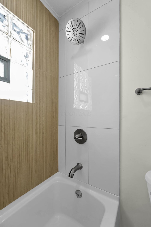 bathroom with toilet and  shower combination