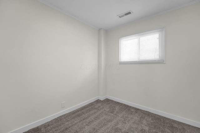 unfurnished room featuring carpet flooring and crown molding