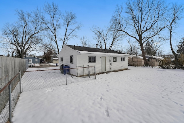 view of snow covered house