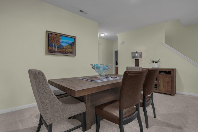 view of carpeted dining space