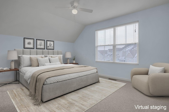 bedroom with ceiling fan, vaulted ceiling, and light carpet