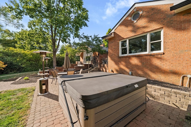 view of patio with a hot tub