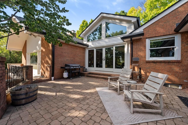 rear view of property featuring a patio area and french doors