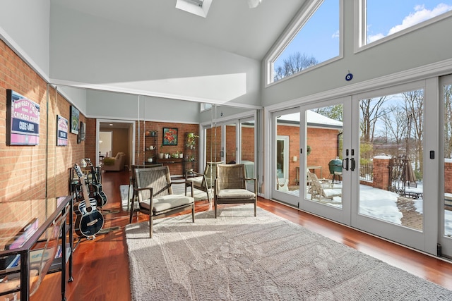 sunroom / solarium with lofted ceiling and french doors