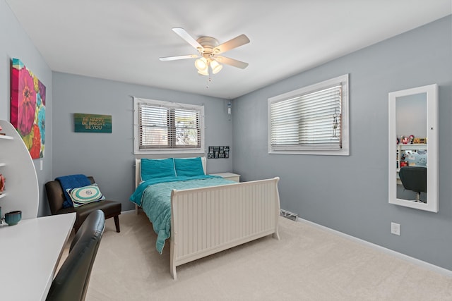 bedroom featuring ceiling fan and light carpet