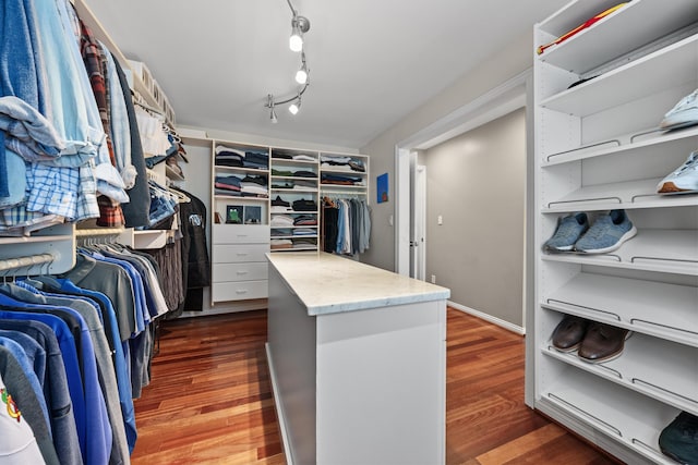 walk in closet featuring dark hardwood / wood-style flooring