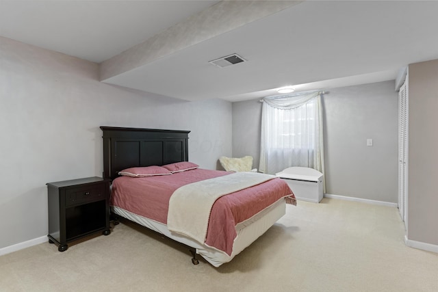 bedroom with light colored carpet