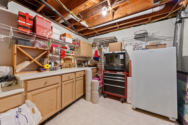 basement featuring white fridge