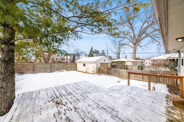 yard layered in snow with a deck