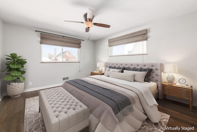 bedroom featuring ceiling fan and dark hardwood / wood-style floors