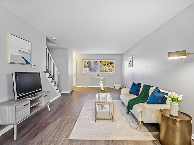 living room with dark hardwood / wood-style flooring