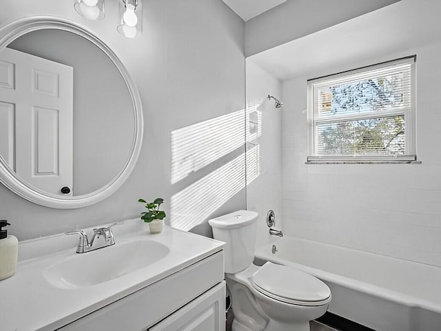 full bathroom featuring toilet, tub / shower combination, and vanity