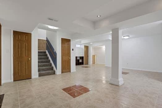 interior space featuring stairway and baseboards