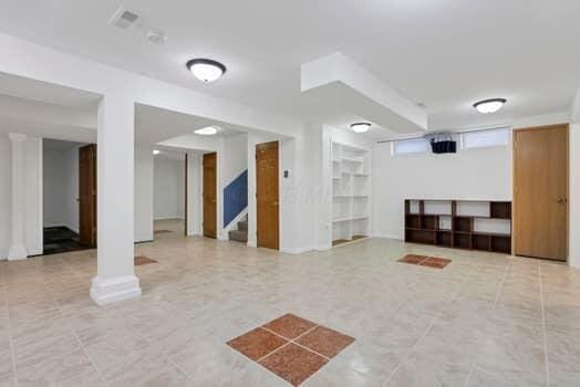 community lobby with stairs and visible vents