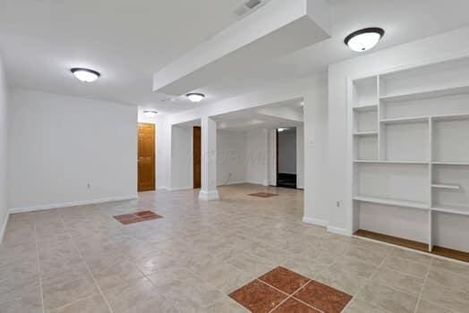 interior space with visible vents and baseboards