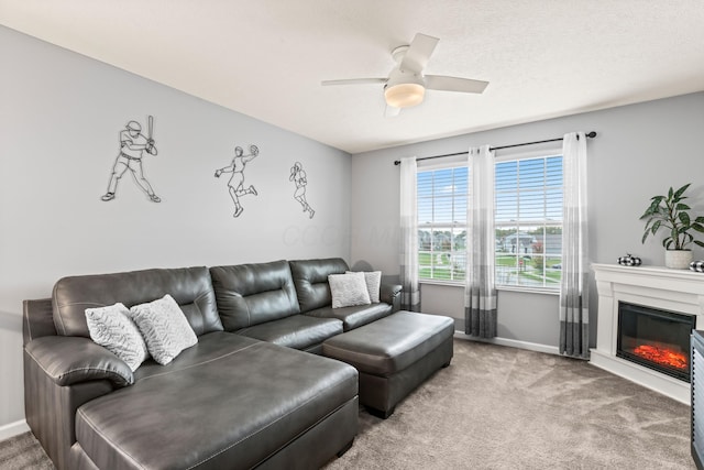 carpeted living room with ceiling fan