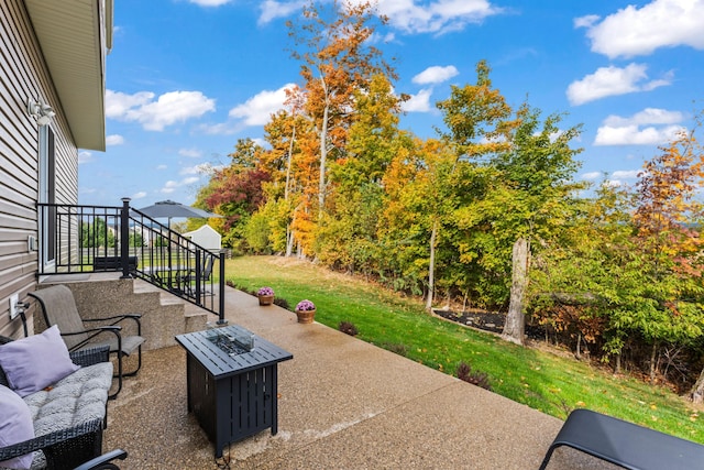 view of patio with a fire pit