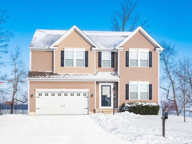 view of front of property with a garage