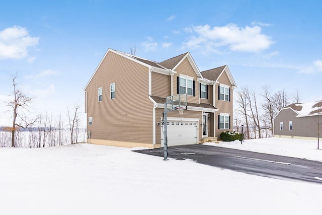 view of snow covered exterior featuring a garage