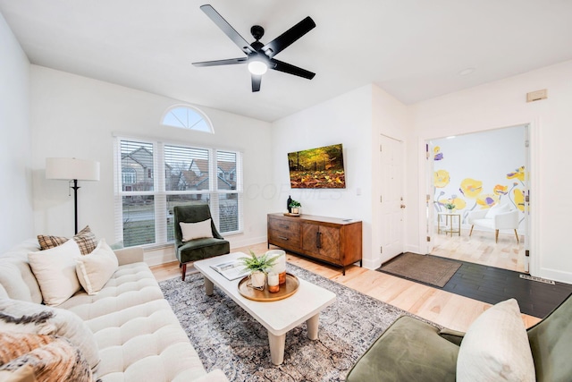 living room featuring hardwood / wood-style flooring and ceiling fan