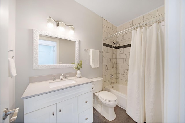 full bathroom with shower / bath combination with curtain, vanity, and toilet