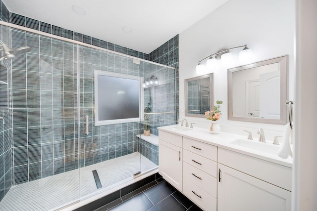 bathroom featuring tile patterned floors, vanity, and an enclosed shower