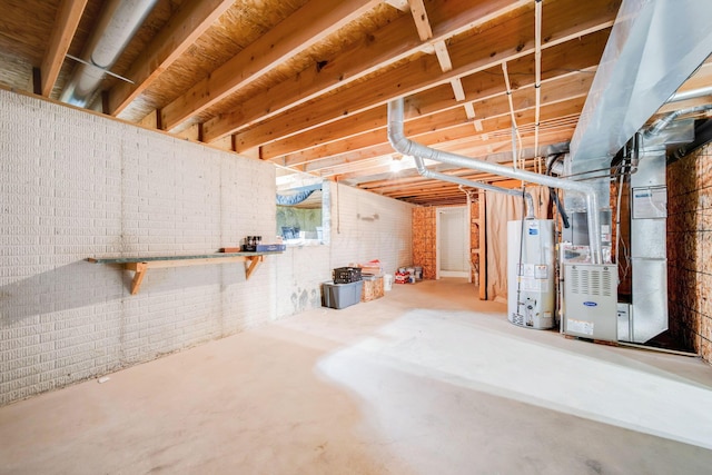 basement with heating unit, brick wall, and water heater