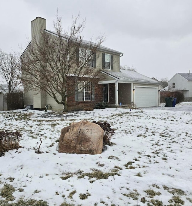 front of property with a garage