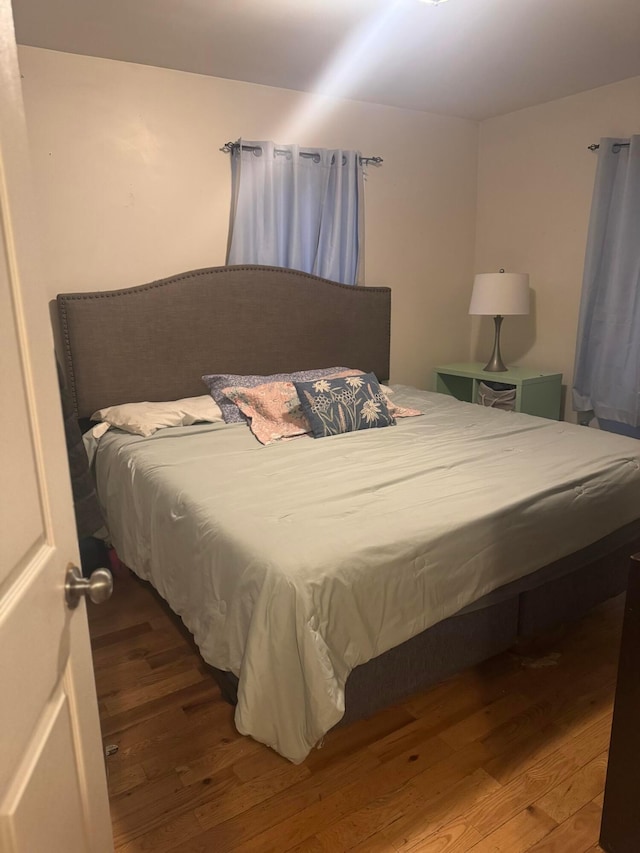 bedroom with hardwood / wood-style flooring