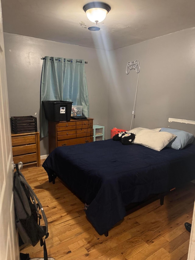 bedroom featuring hardwood / wood-style flooring