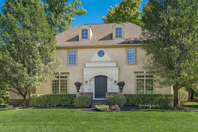 view of front of house with a front lawn