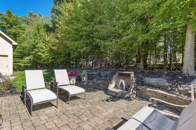 view of patio featuring an outdoor fire pit