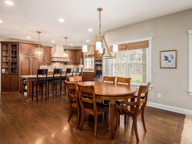 dining space with dark wood-type flooring