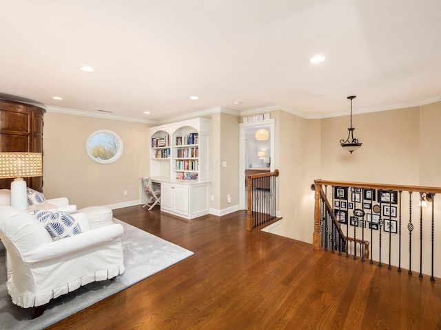 living area featuring crown molding and dark wood-type flooring