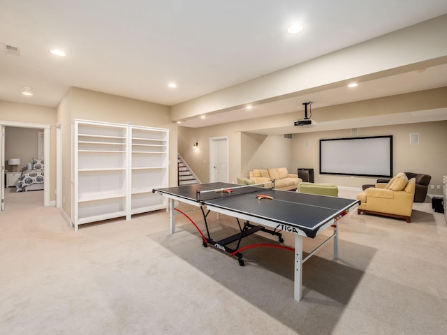 recreation room with light carpet