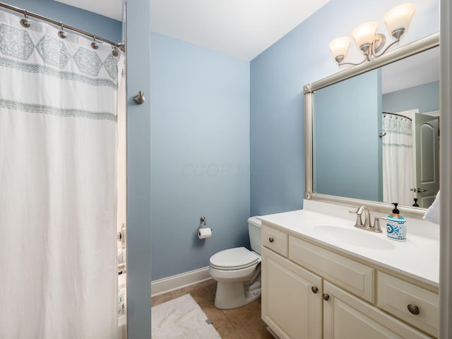 bathroom featuring toilet, vanity, and tile patterned floors