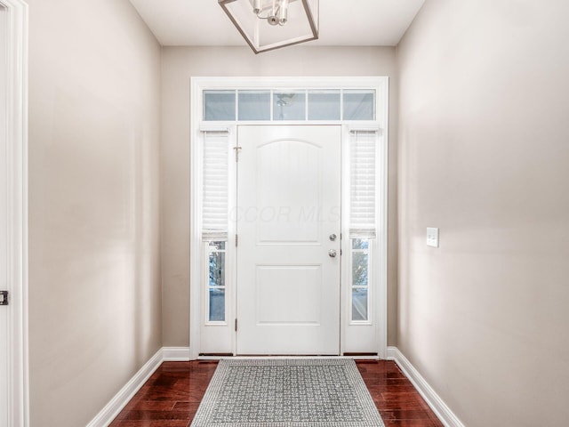 foyer with dark wood-type flooring